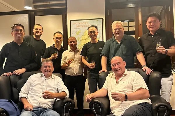 Guests tasting whisky at the Whisky and Whiskers event in Singapore