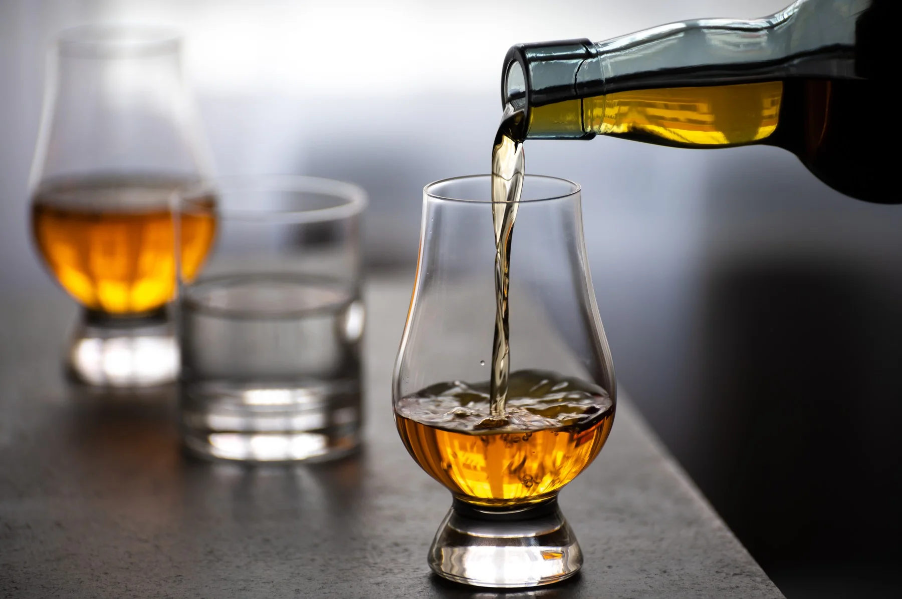 Amber whisky poured into a Glencairn glass